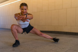 Caucasian Woman Stretching In The City