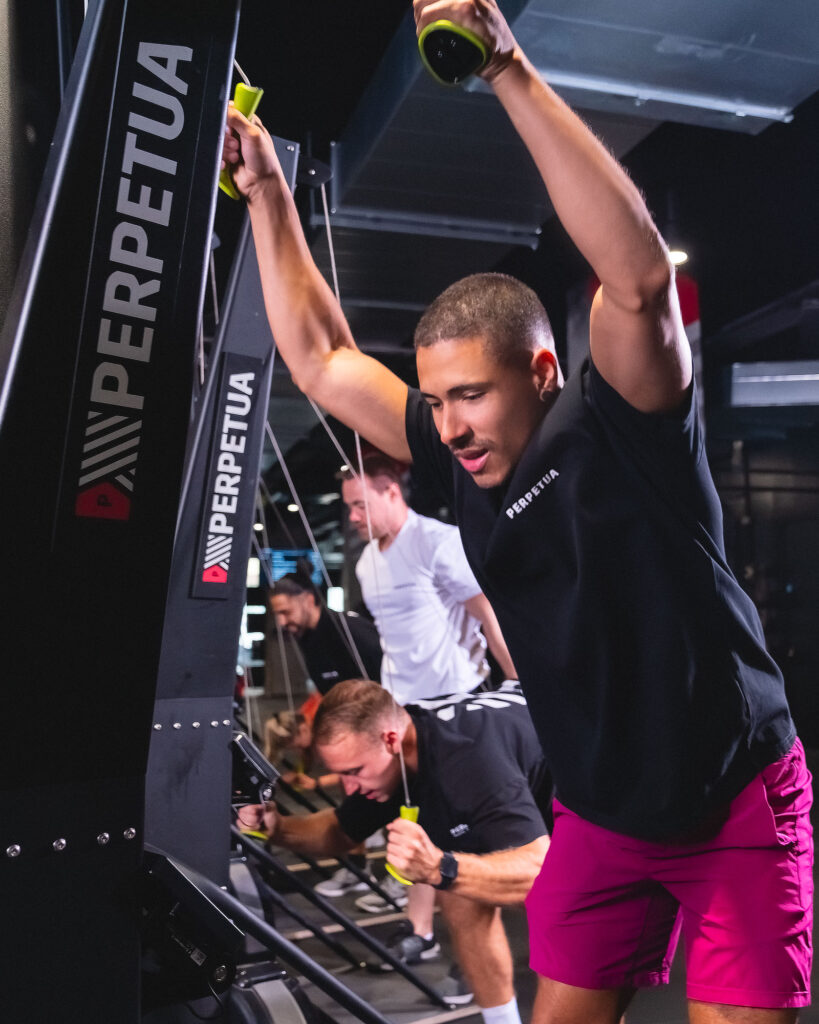 Man using the SkiErg machine during high-intensity training at Perpetua Gym Dublin.