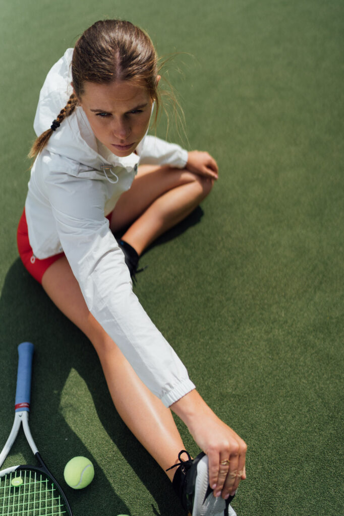 Sarah Hawkshaw Stretches at Trinity College Dublin Tennis Court